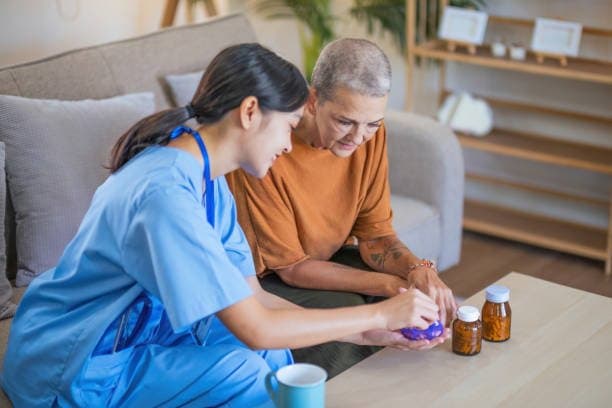 Nurse assisting with administering medication